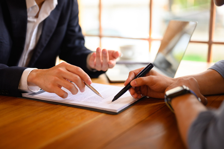 Closeup lawyer pointing at contract