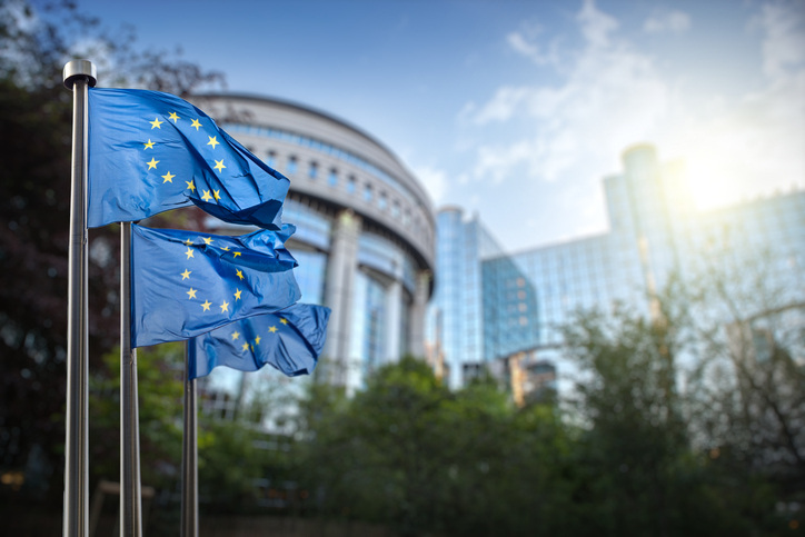 European union flag against parliament