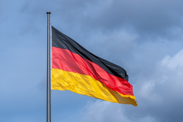 German flag against cloudy sky, Berlin central