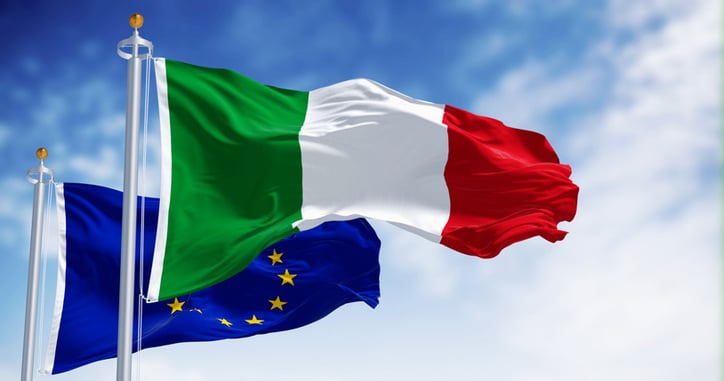 National flag of Italy waving in the wind with the European Union flag