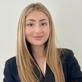  Professional headshot of Aliki Halcoussi, Investment Associate at Deminor Litigation Funding